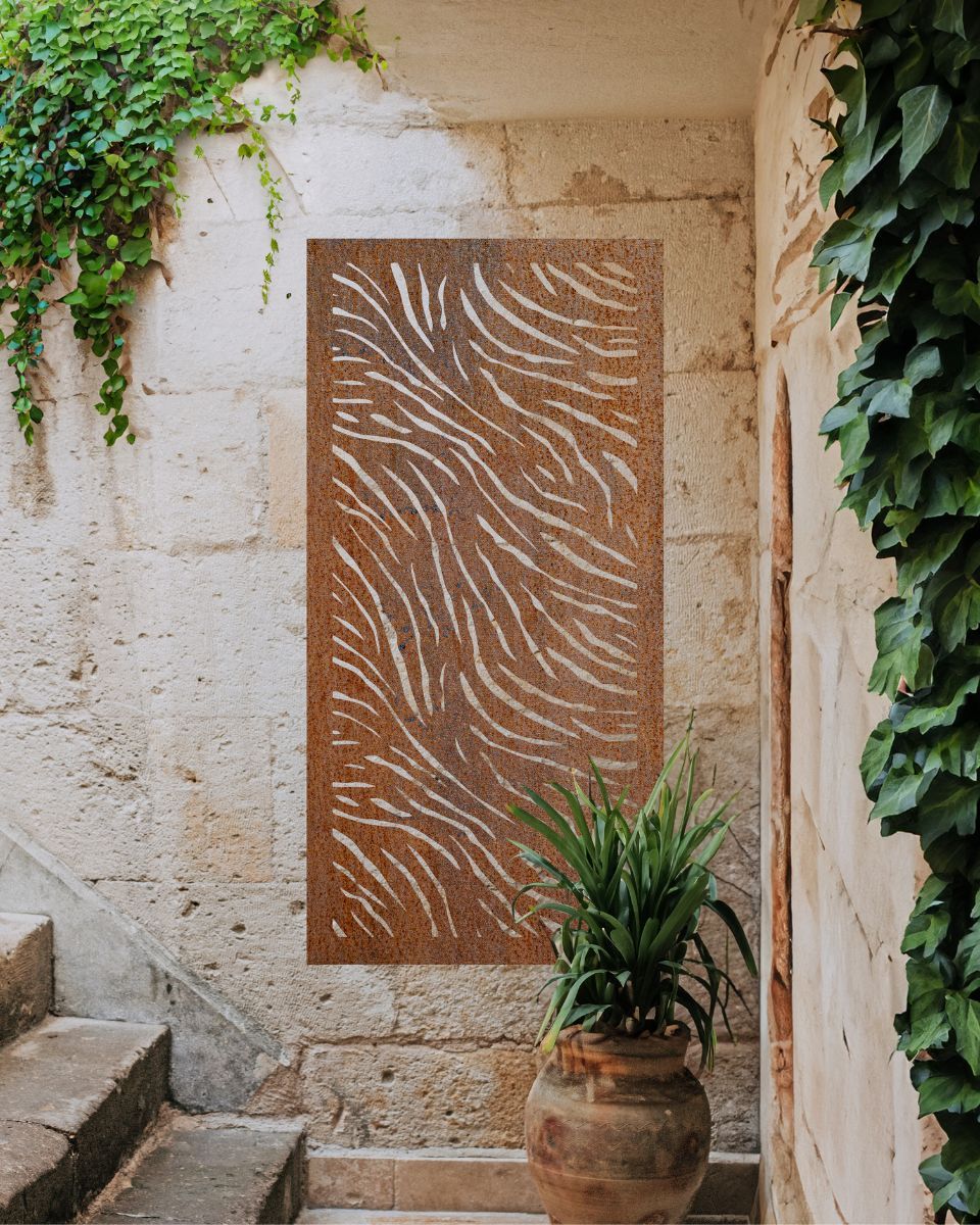 "Rust Finish Zebra print Garden Wall Art" mounted onto a brick wall next to stairs and plants "Rust Finish Zebra print Garden Wall Art" mounted onto a brick wall next to stairs and plants