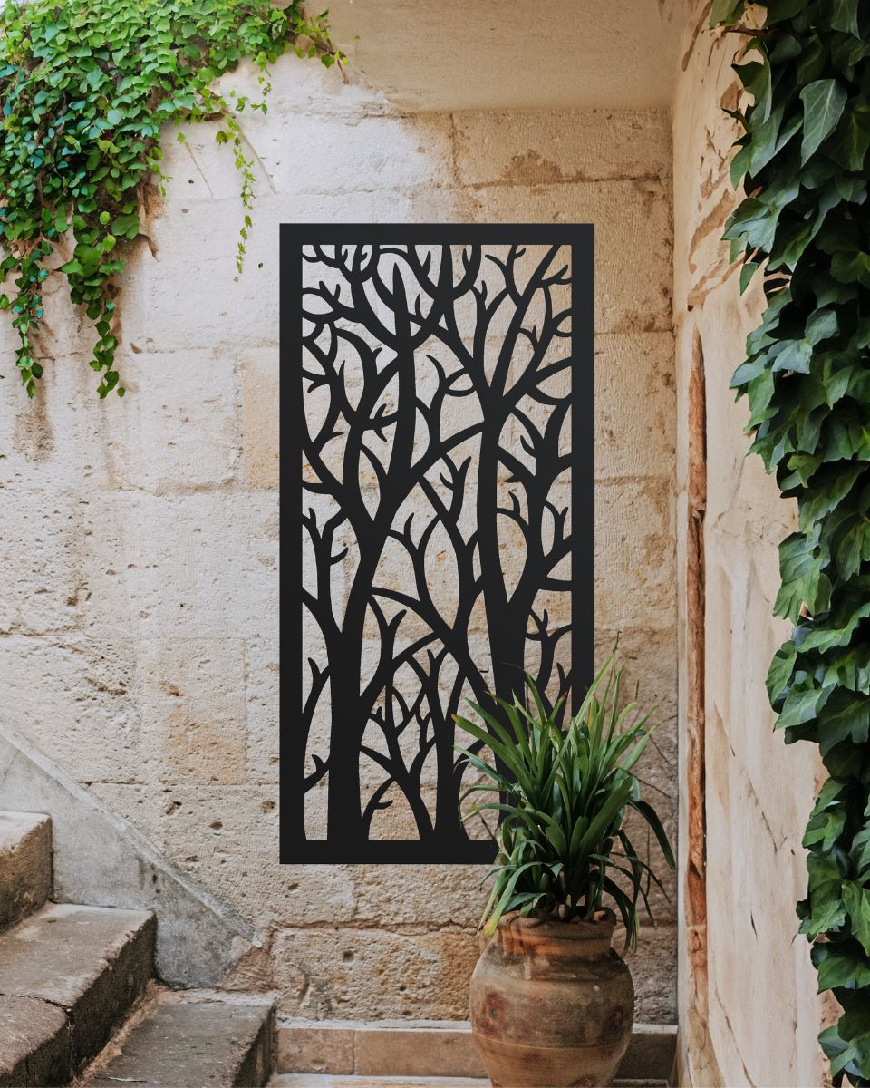 "Black Autumnal Trees Garden Wall Screen" mounted on a brick wall next to stairs