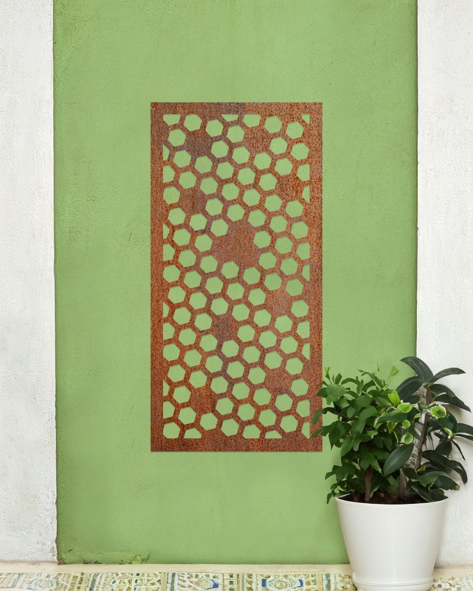 Rustic" Honeycomb Pattern Wall Art" mounted on a green wall next to a potted plant Rustic" Honeycomb Pattern Wall Art" mounted on a green wall next to a potted plant