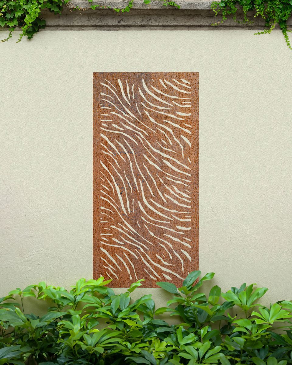 "Rust Finish Zebra print Garden Wall Art" on a cream outdoor wall amongst plants "Rust Finish Zebra print Garden Wall Art" on a cream outdoor wall amongst plants