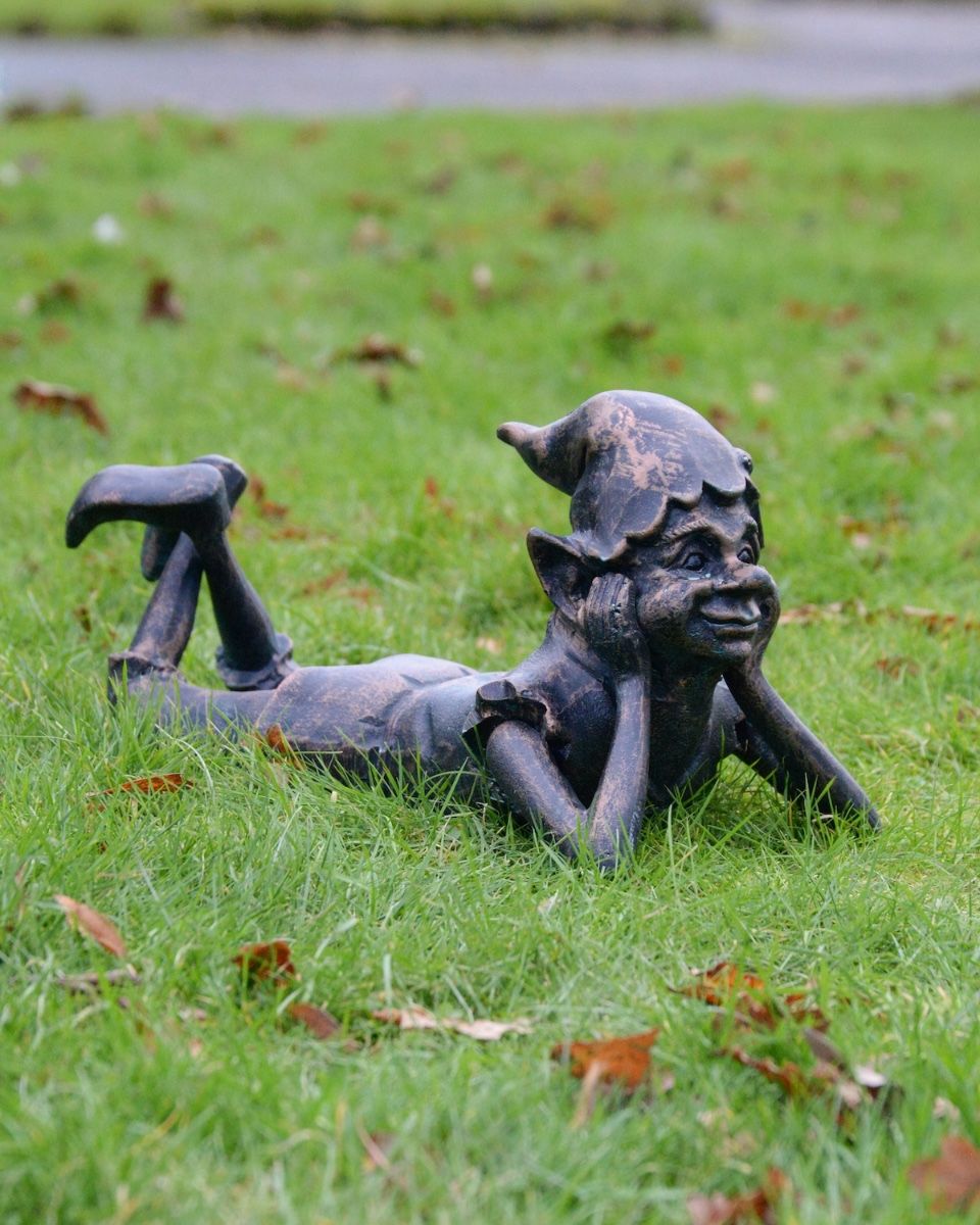 "Reverie" the Pixie Cast Aluminium Garden Sculpture main image lying on grass in verdigris