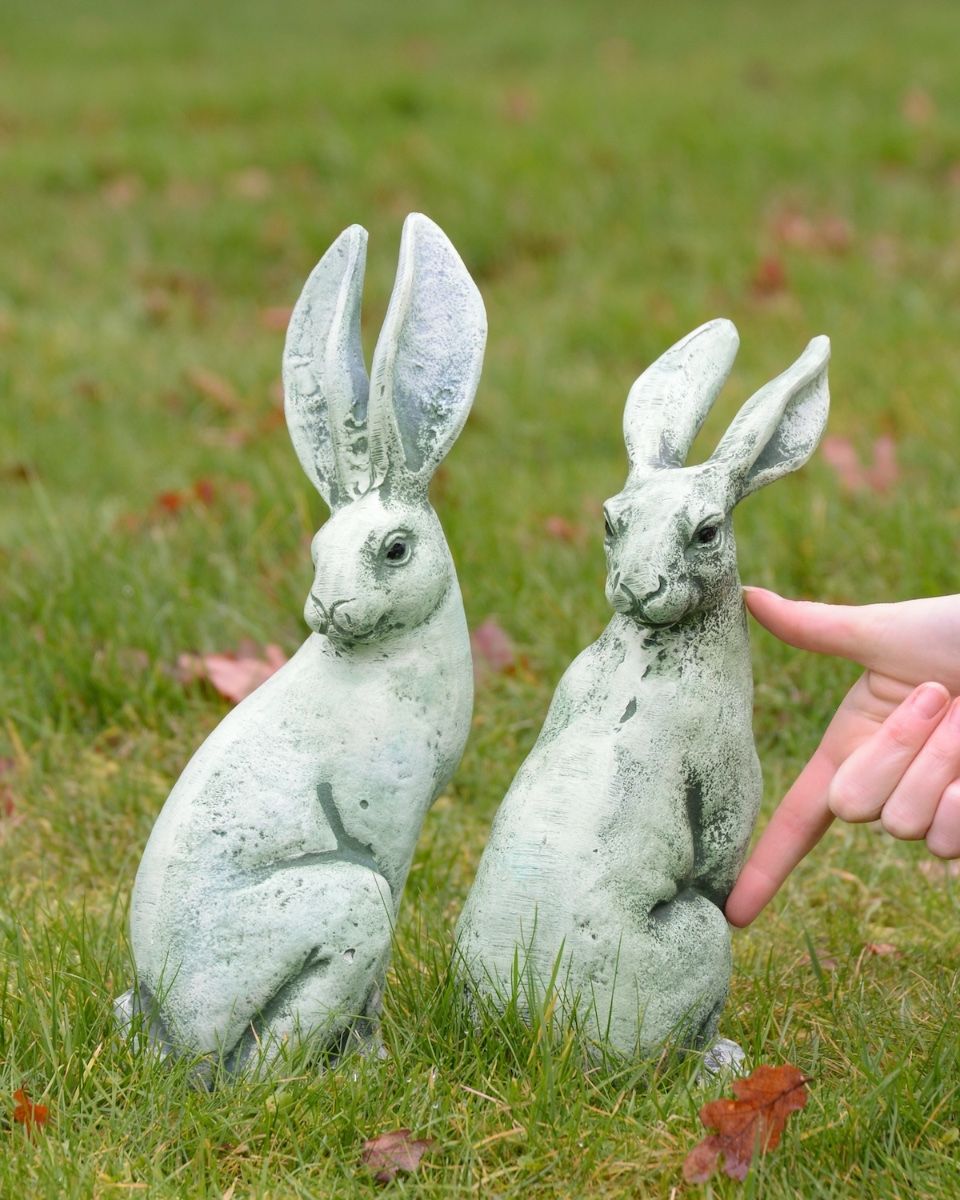 Verdant Watchers Pair of Sitting Rabbit Garden Sculpture Cast Aluminium to scale with hand in shot
