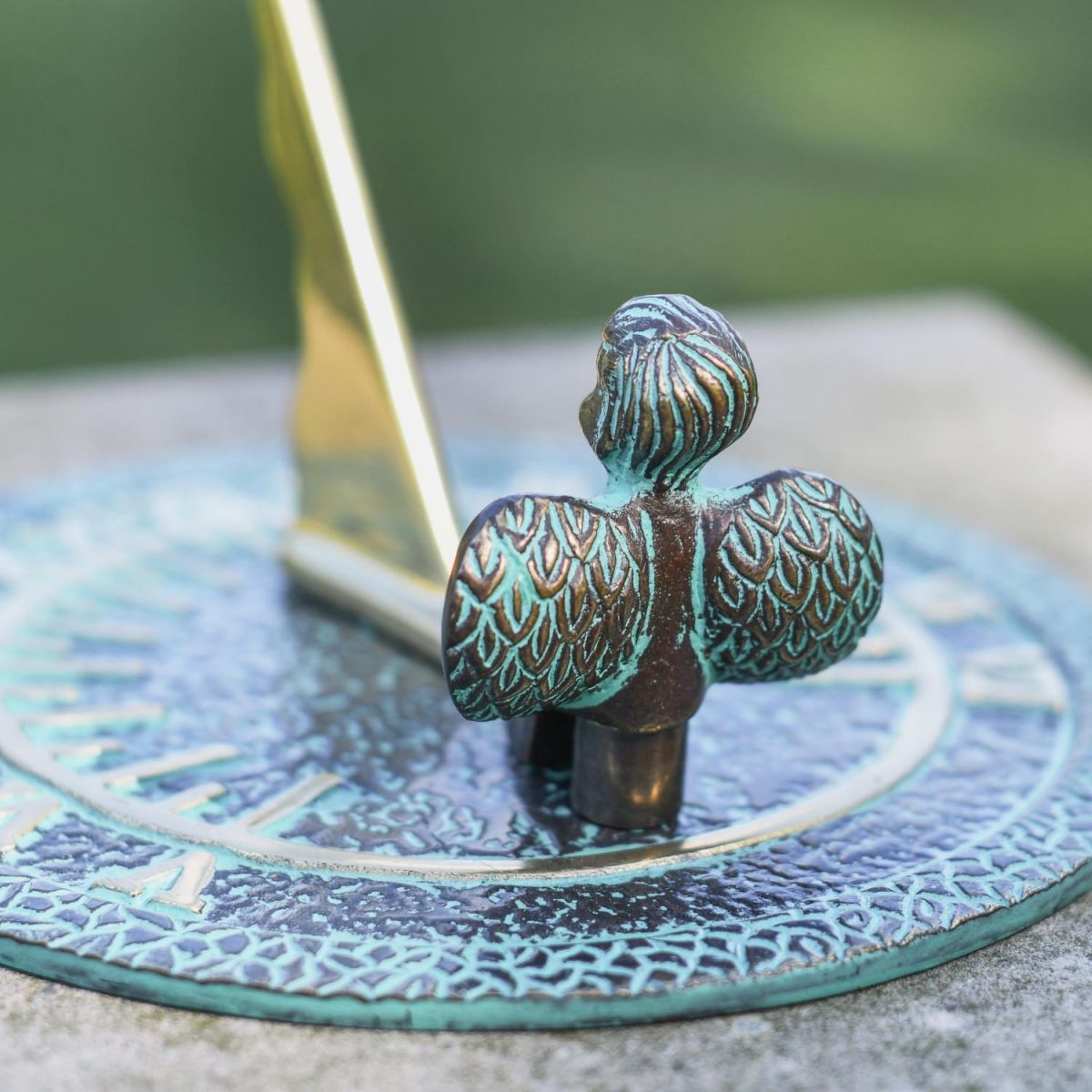 Close-Up of Winged Guardian Angel Topper on Verdigris Sundial Close-Up of Winged Guardian Angel Topper on Verdigris Sundial