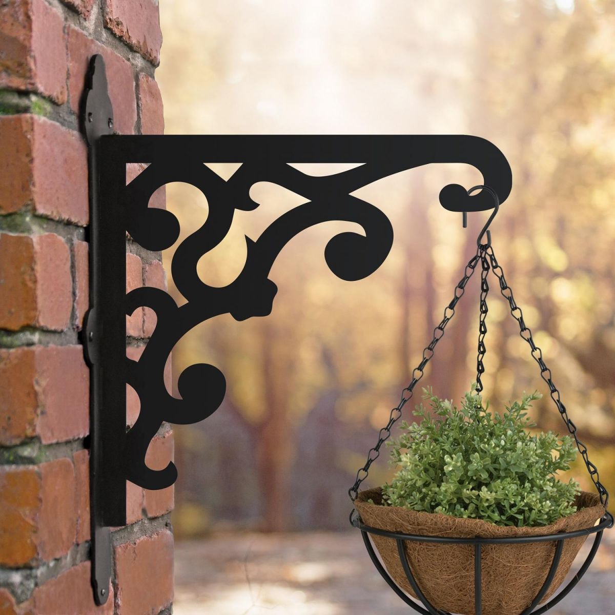 Victorian Gingerbread Style Hanging Basket Bracket Mounted onto a Brick Wall 