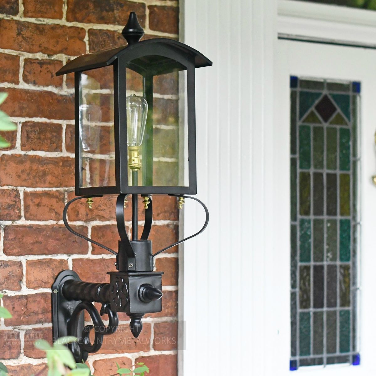 Victorian Wall Lantern With Curved Top Installed By Front Door