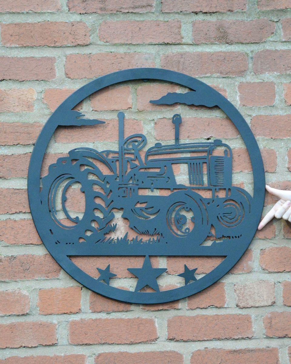 Vintage Fender Tractor Silhouette Garden Wall Art to scale with hand in shot