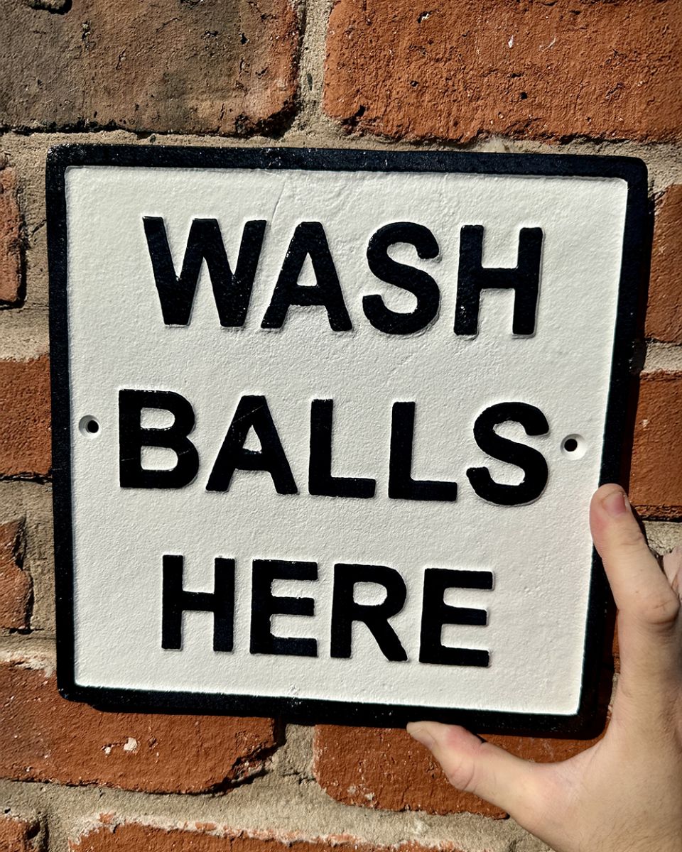 Cast iron wash balls here wall sign