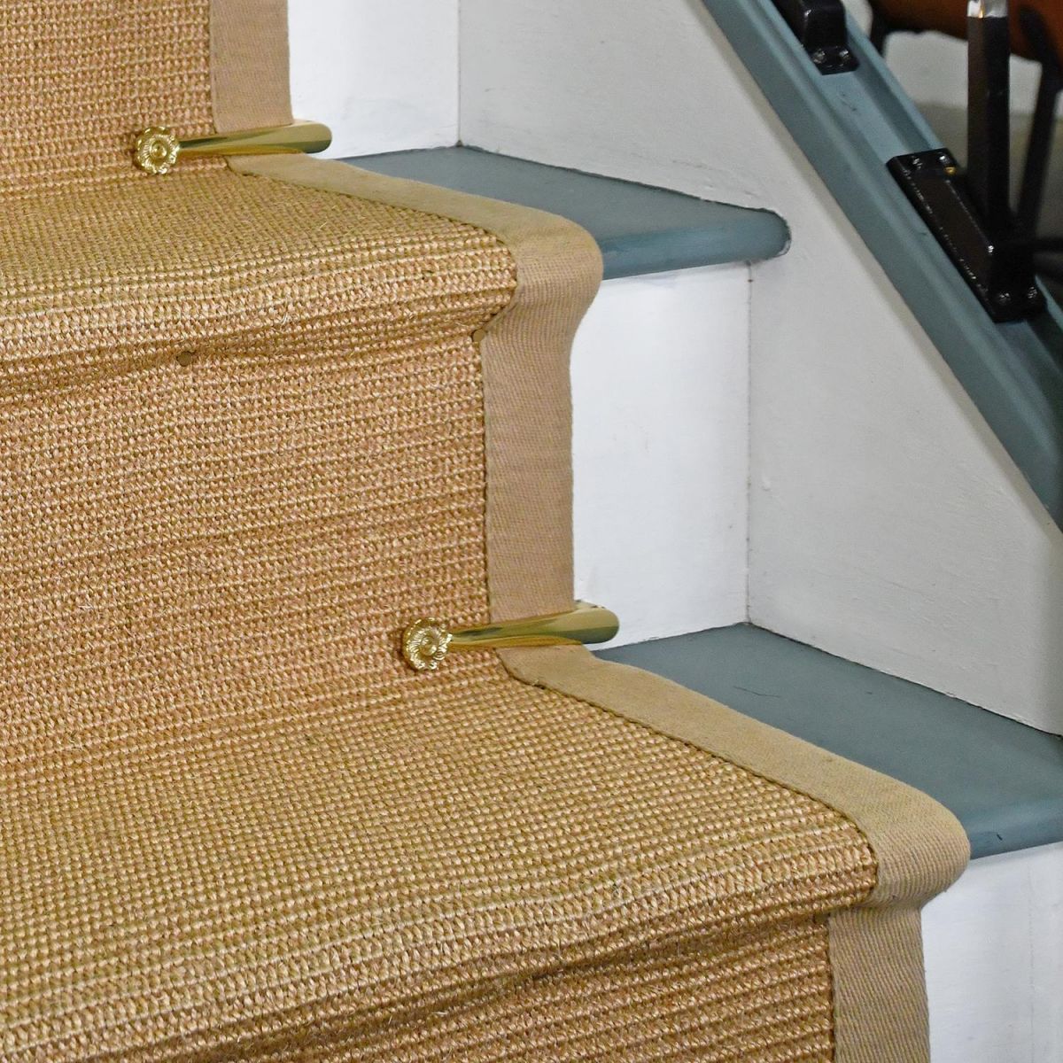 Polished Brass Stair Clip in Use on a Stair Case