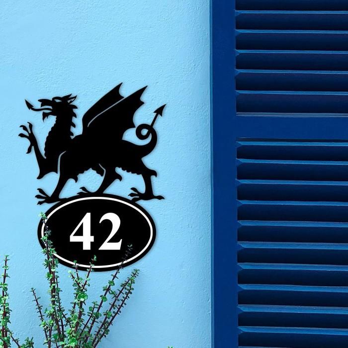Welsh Dragon Iron House Number Sign in Situ on a Blue Wall Welsh Dragon Iron House Number Sign in Situ on a Blue Wall
