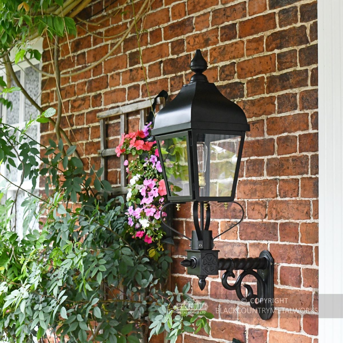 Westwell Black Simplistic Victorian Wall Light Installed On Brick Wall