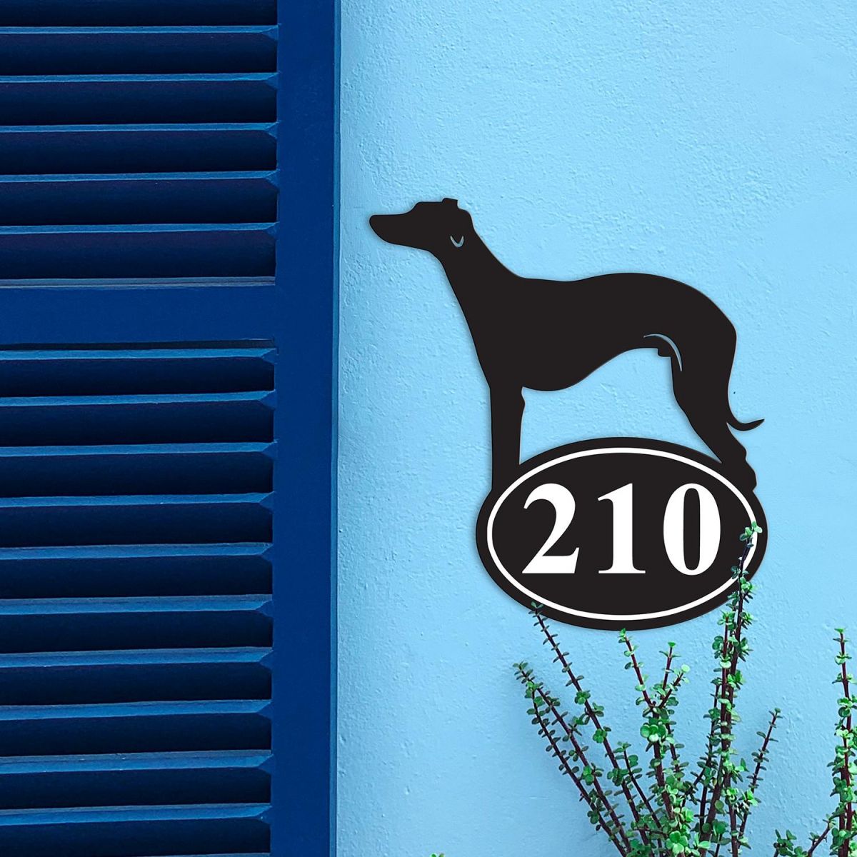 Whippet Iron House Number Sign in Situ on a Blue Wall 