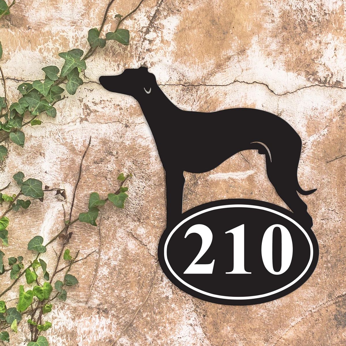 Whippet Iron House Number Sign in Situ on a Rustic Wall 