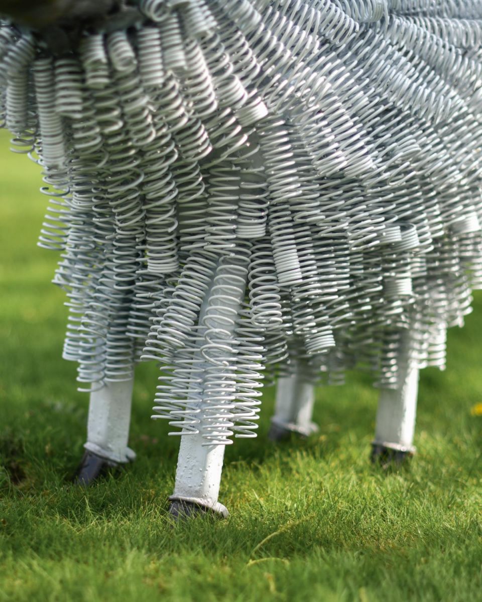 Close-Up of Freestanding Twisted Metal Garden Sculpture in White