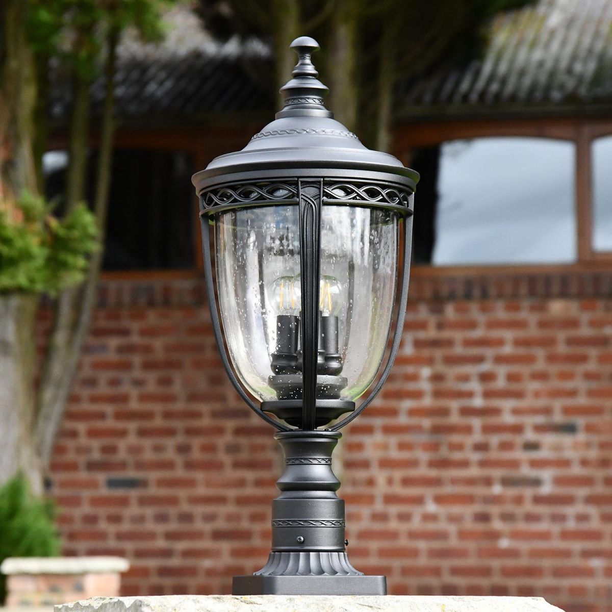 "Winsford" Black Traditional Countryside Pillar Light in Use in the Garden