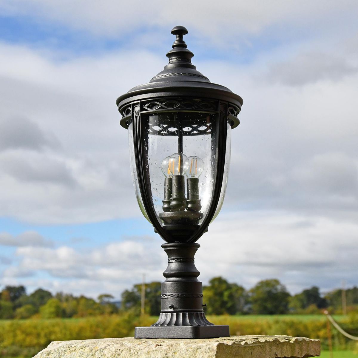 "Winsford" Black Traditional Countryside Pillar Light in Situ Outdoors