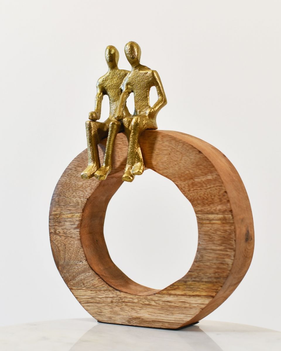 Angled view of cast aluminium and mango wood art sculpture Angled view of cast aluminium and mango wood art sculpture