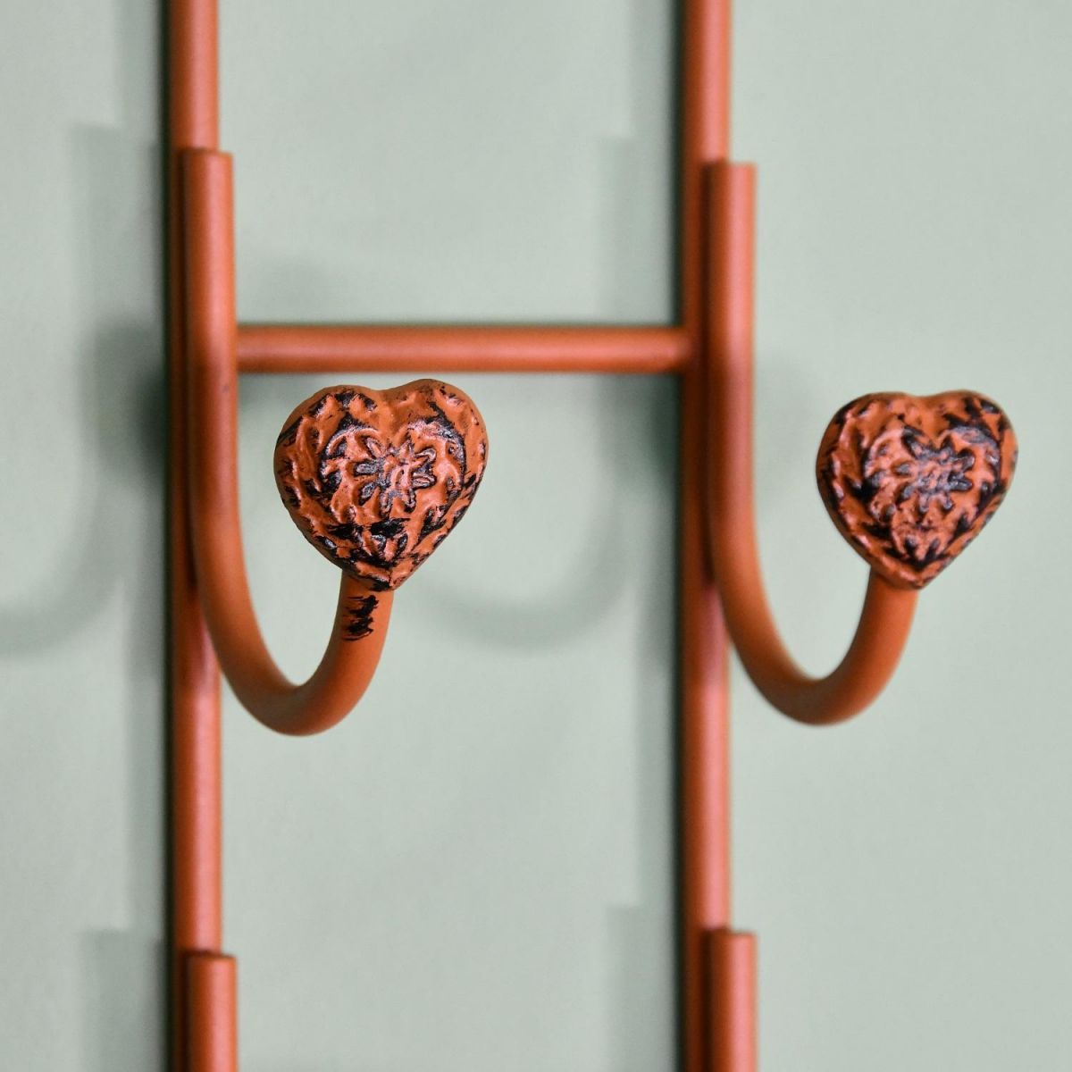 Close up of detailed heart bottle hooks Close up of detailed heart bottle hooks