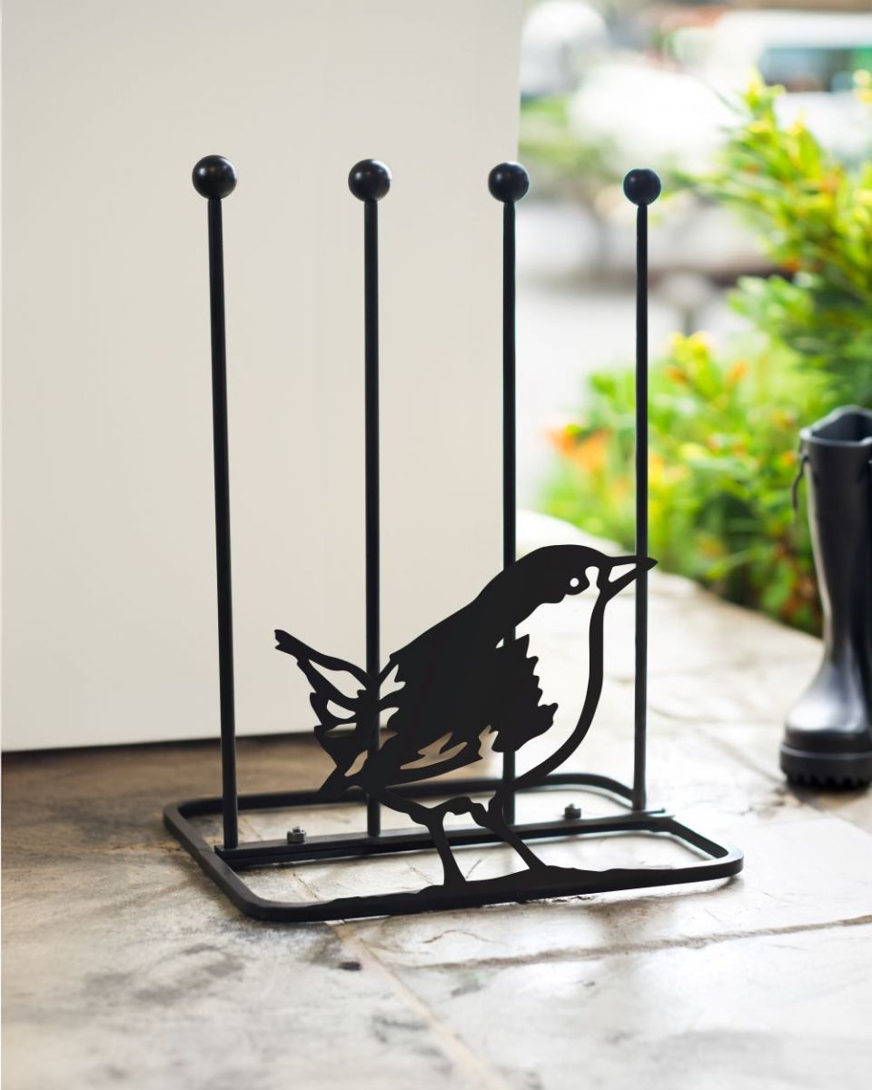 Boot rack with Wren silhouette in porch
