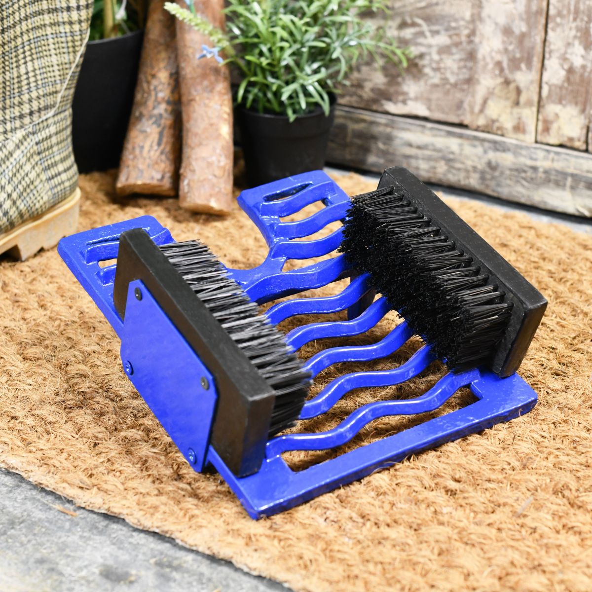 Bright Blue three in one boot brush, jack and scraper on door matt