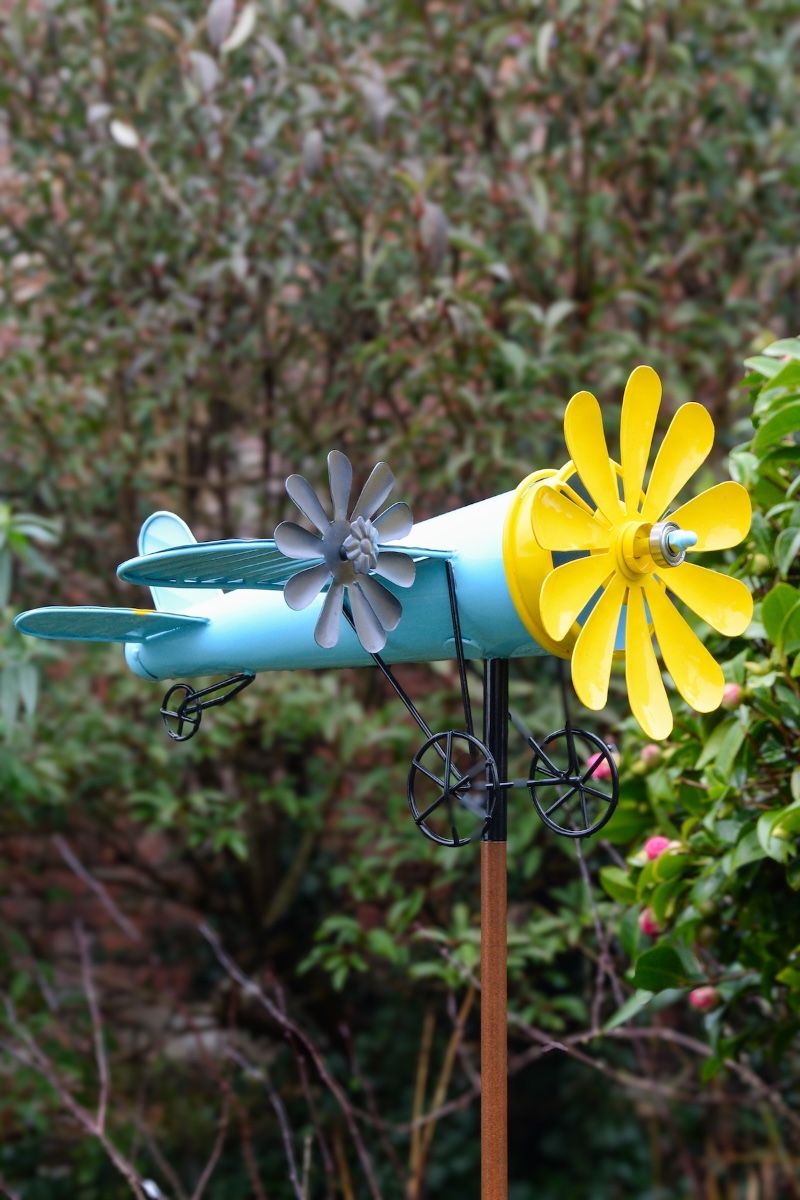 Vintage Airplane Wind Spinner Stakes in Blue and Yellow Close up of Plane