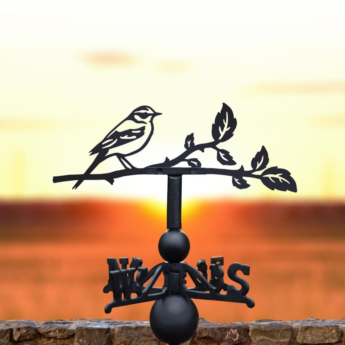 Yellow wagtail weathervane in the sunset