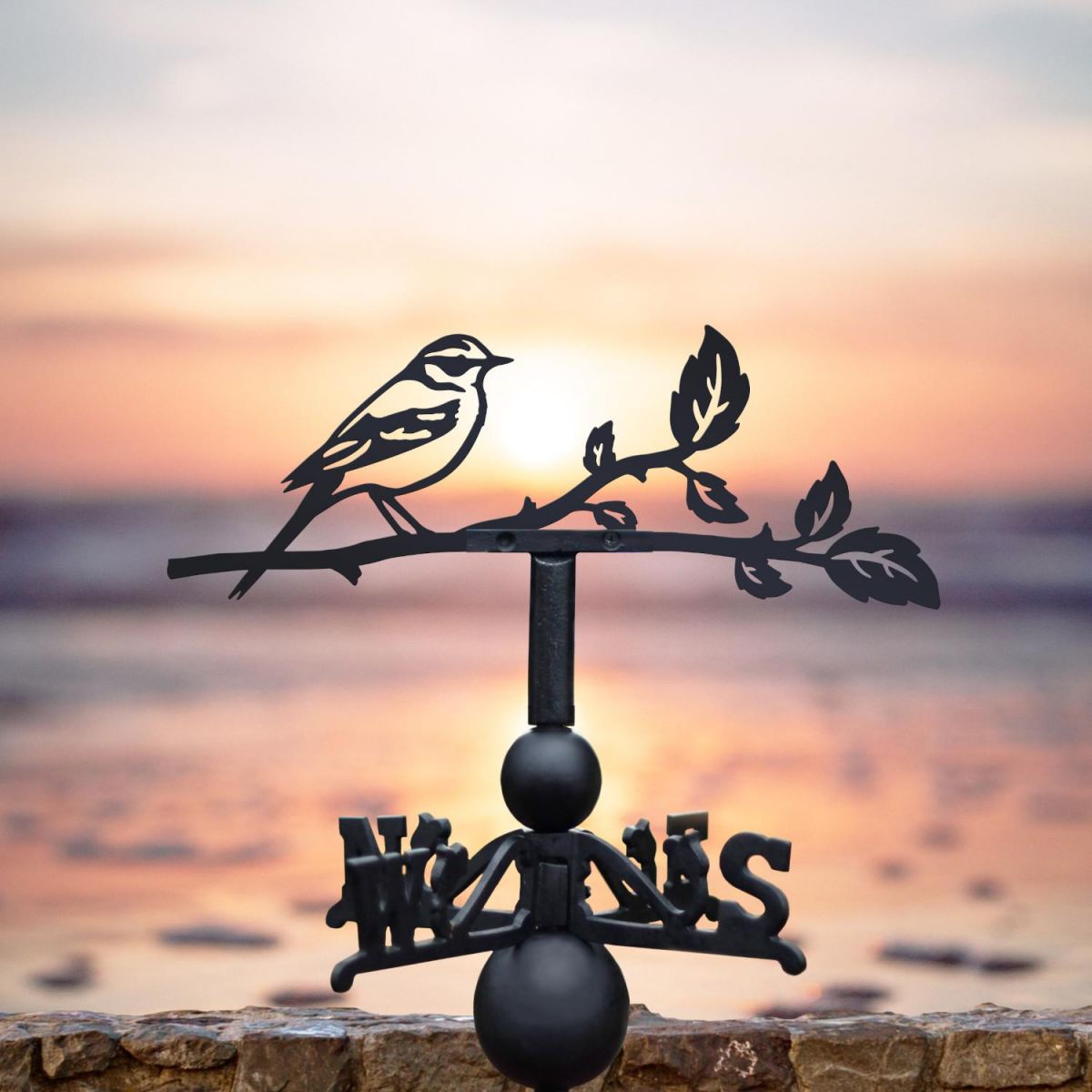 Yellow wagtail weathervane located at the beach