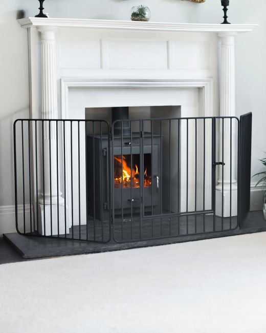 "Freyja" Heavy Duty Fire Guard With Door in Situ Next to the Fireplace