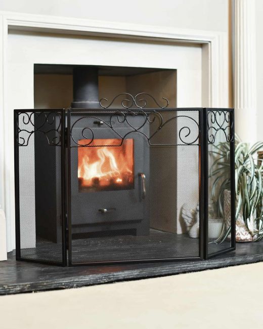 Black Three fold Fire screen in living room Black Three fold Fire screen in living room