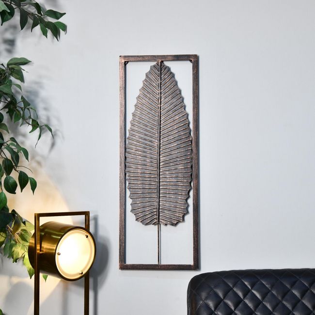 Antique Bronze Leaf Wall Art in Frame Next to a Lamp and a Chair Antique Bronze Leaf Wall Art in Frame Next to a Lamp and a Chair