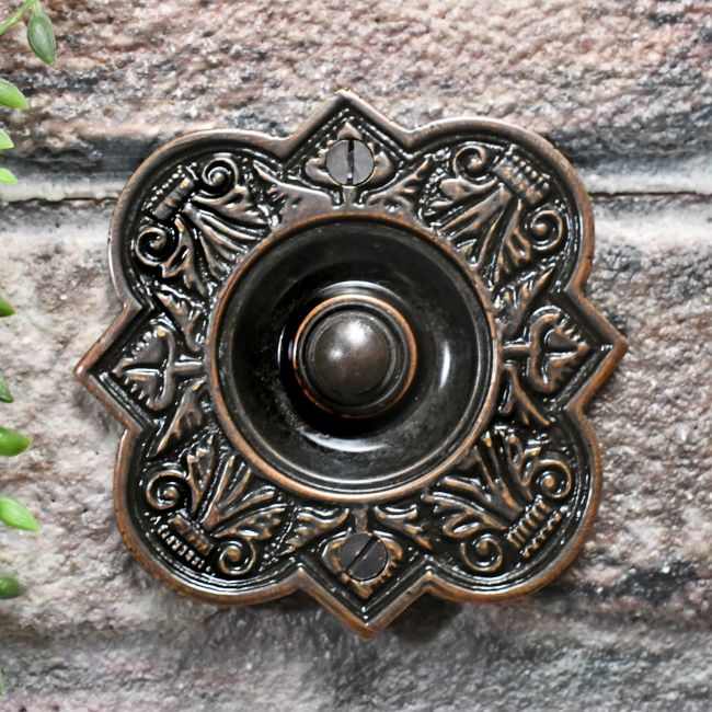 Burnished Copper Period Bell push on brick wall Burnished Copper Period Bell push on brick wall