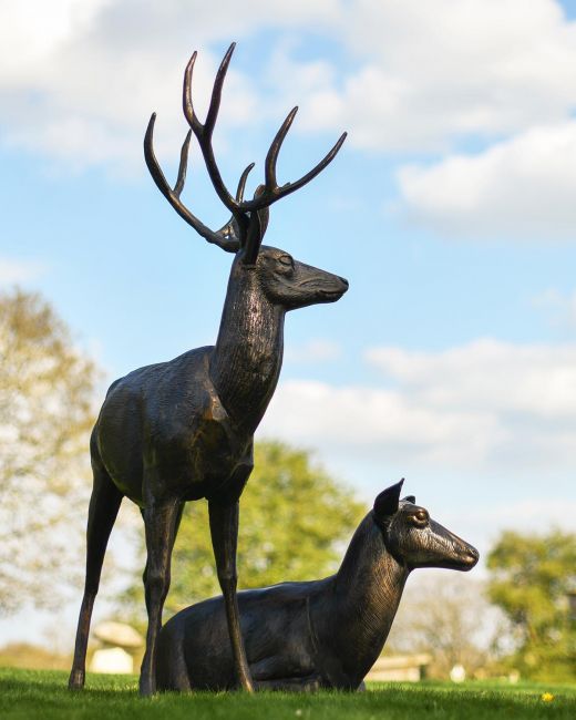 Cast Aluminium Standing Stag and Sitting Doe Sculptures in Situ Cast Aluminium Standing Stag and Sitting Doe Sculptures in Situ