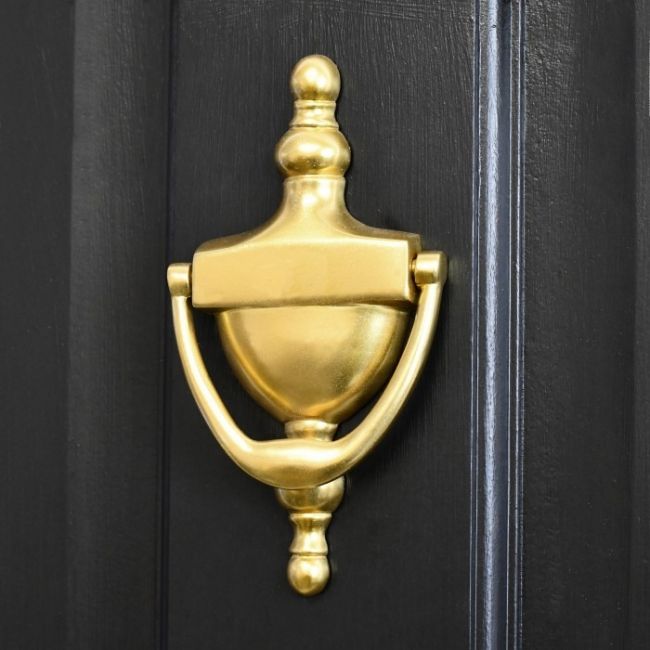 Gold Anodised Urn Door Knocker on a Black Door Gold Anodised Urn Door Knocker on a Black Door