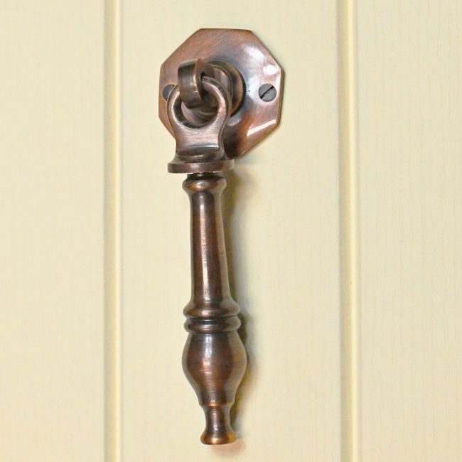 Antique Copper door knocker on Cream door