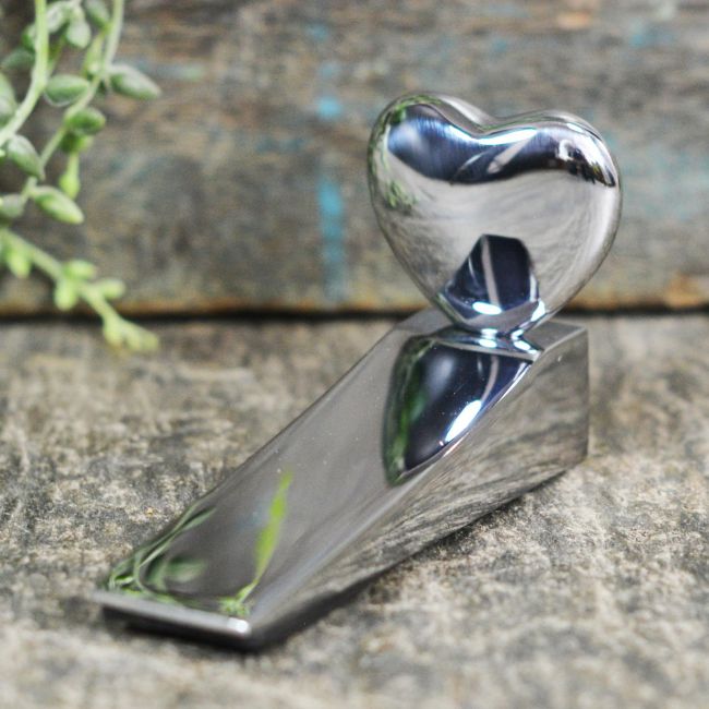 Heart Design Door Wedge in a Bright Chrome Finish Heart Design Door Wedge in a Bright Chrome Finish