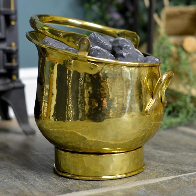 Polished Brass Coal Bucket holding Coal By the Fireplace