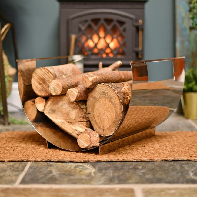 Stainless Steel Curved log holder infront of fire Stainless Steel Curved log holder infront of fire