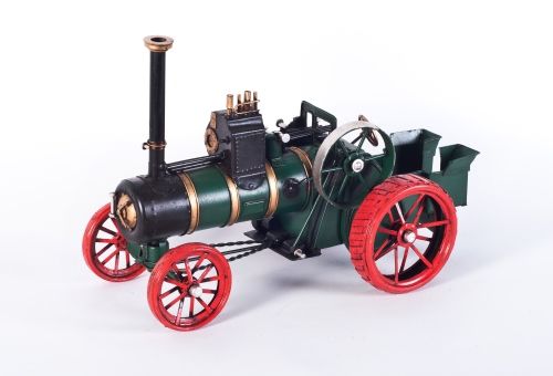 Period green steam engine tractor model Period green steam engine tractor model