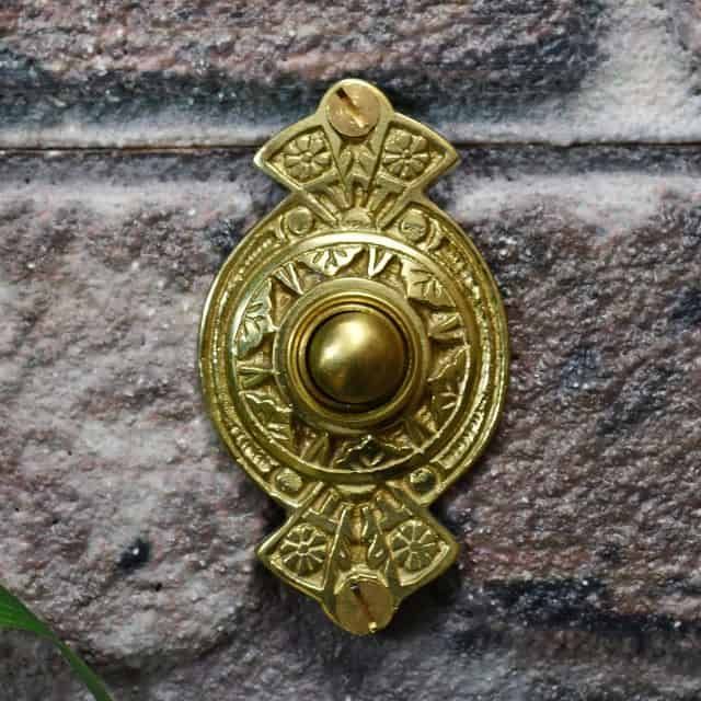 Polished brass front door bell push Polished brass front door bell push