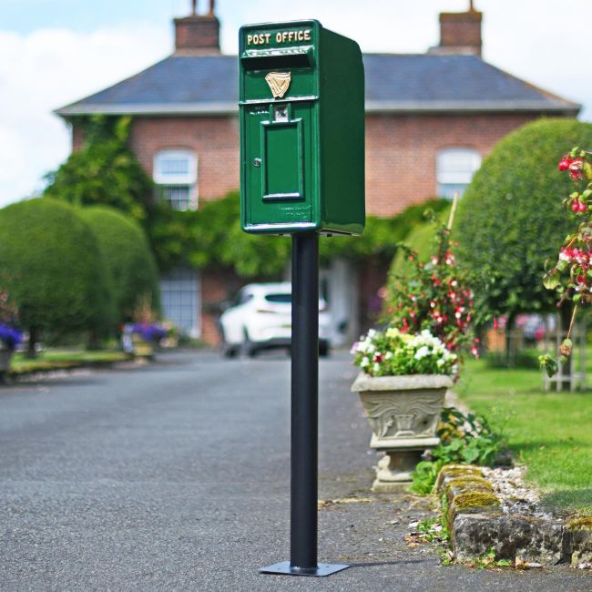 Irish Harp Post and Parcel Box Finished in Green standing on a Black Column Irish Harp Post and Parcel Box Finished in Green standing on a Black Column