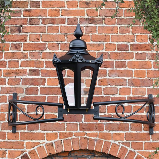Hexagonal canopy lantern on ornate bow bracket
