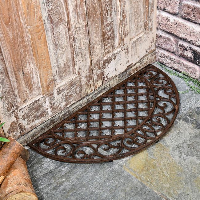 Cast Iron Door Mat with an Ornate Design in Situ by the Front Cast Iron Door Mat with an Ornate Design in Situ by the Front