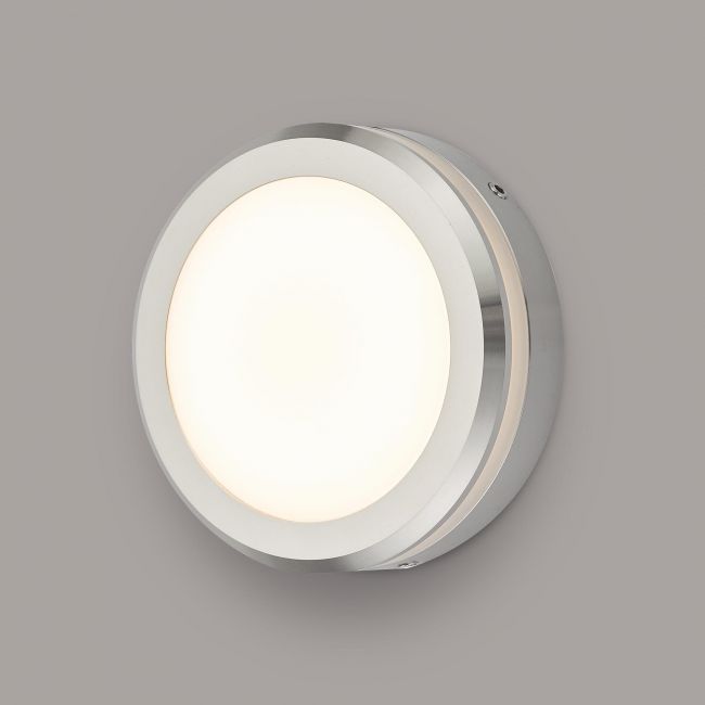 Polished Aluminium Round Wall Light in Situ on a Grey Wall Polished Aluminium Round Wall Light in Situ on a Grey Wall