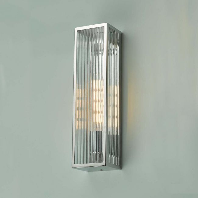 Polished Stainless Steel Reeded Glass Wall Light in Situ on a Green Wall Polished Stainless Steel Reeded Glass Wall Light in Situ on a Green Wall