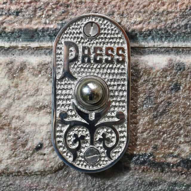 Old Fashioned Door Bell on brick wall Old Fashioned Door Bell on brick wall