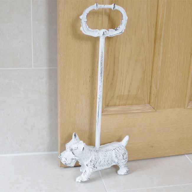 Rustic West Highland White Terrier Door Stop in Situ Holding Open a Wooden Door Rustic West Highland White Terrier Door Stop in Situ Holding Open a Wooden Door