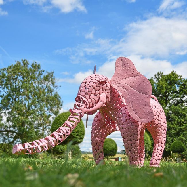 "Sambaku" Pink Garden Elephant Sculpture in Use in the Garden "Sambaku" Pink Garden Elephant Sculpture in Use in the Garden