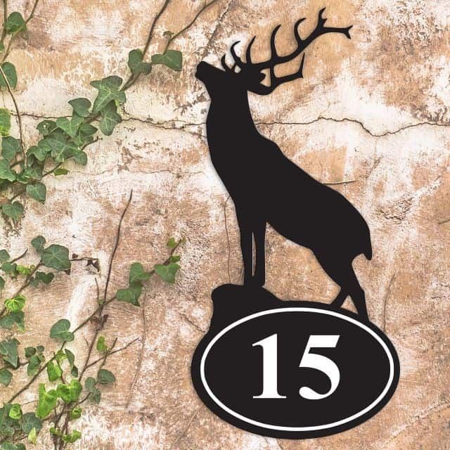 Stag Iron House Number Sign on a Garden Wall Stag Iron House Number Sign on a Garden Wall