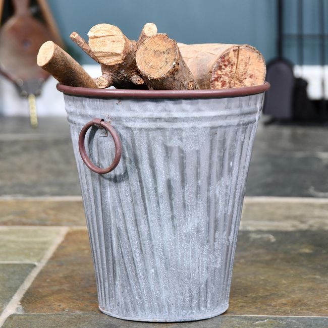 Steel "The Burley" Vase Log Basket in Use Holding Logs Steel "The Burley" Vase Log Basket in Use Holding Logs