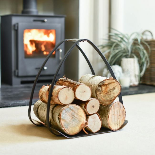 The Ternion Contemporary Log Holder In A Fireplace setting
