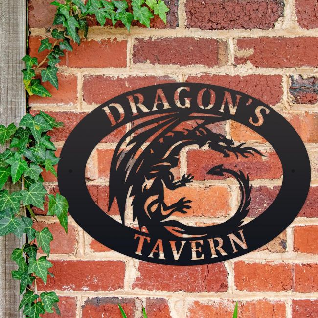 Tribal Dragon Iron Oval House Sign on a Brick Wall